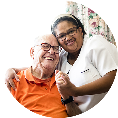 a nurse and an elderly laughing