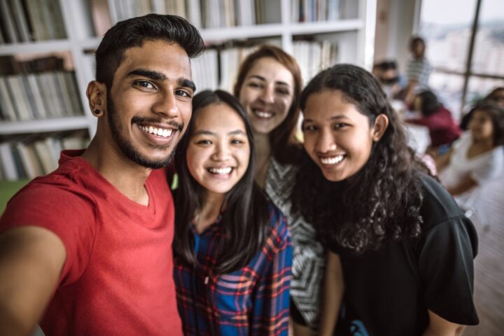 Students taking a selfie At Library